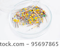 Insulated Dental Universal Pro Tapers Set. Drills for root canal treatment. White background. Petri dish with probes. 95697865