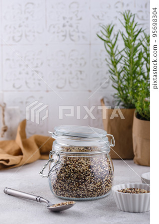 Red, white and brown quinoa. 95698304