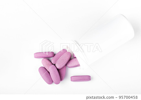 Purple pills in a white jar 95700458