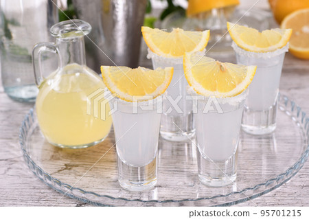 Shots vodka with lemon Shots vodka with lemon 95701215