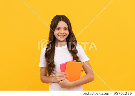 smiling school child ready to study with workbook, school smiling school child ready to study with workbook, school 95701259