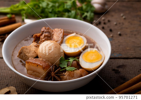 Egg and Pork in Sweet Brown Sauce ,Kai Pa Lo in white bowl. Egg and Pork in Sweet Brown Sauce ,Kai Pa Lo in white bowl. 95701271