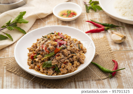 Stir Fried Minced Pork with Basil leave on white plate Stir Fried Minced Pork with Basil leave on white plate 95701325