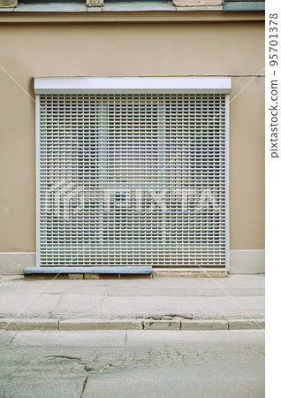 closed roller shutter on the store, stores are closed due to the crisis. 95701378