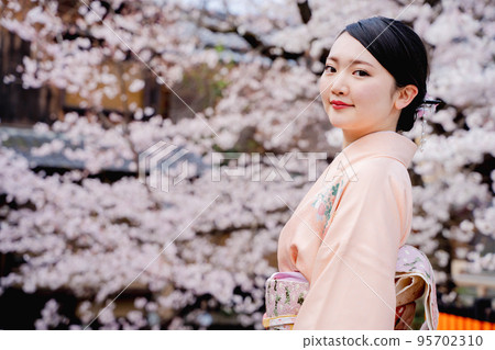 Kimono woman and cherry blossoms Kyoto 95702310