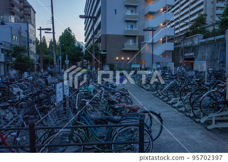 bicycle parking lot at sunset bicycle parking lot at sunset 95702397