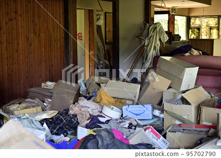 Garbage mansion. A pile of garbage illegally dumped in an unoccupied house. 95702790