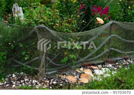 landscape design in a seaside village, a flower bed is fenced with