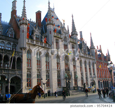 Bruges, Flemish region, Belgium- 10.20.2010. Provinciaal Hof Brugge, Market Square Bruges, The building of the Government of the Province of West Flanders, a beautiful old building in the Gothic style Bruges, Flemish region, Belgium- 10.20.2010. Provinciaal Hof Brugge, Market Square Bruges, The building of the Government of the Province of West Flanders, a beautiful old building in the Gothic style 95704414