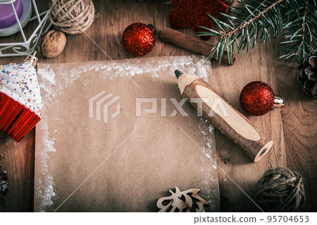 greeting card and pencil in the Christmas background. 95704653