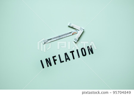 Inflation financial crisis concept. Growing up arrow from dollar banknote and word Inflation on blue background. Rising cost of living. Inflation financial crisis concept. Growing up arrow from dollar banknote and word Inflation on blue background. Rising cost of living. 95704849