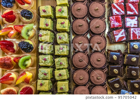Assortment of delicious and colorful dessert with fruits Assortment of delicious and colorful dessert with fruits 95705042