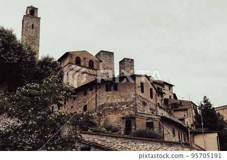Low-angle view of San Gimignano, Tuscany landscape and landmarks. Summer in Italy 95705191