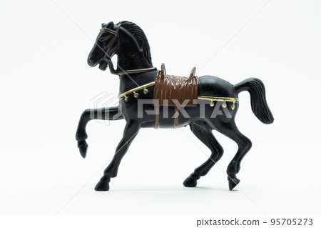 Statuette of black horse isolated on white. Statuette of black horse isolated on white. 95705273