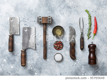 Meat utensils set on light background. Fork,knife,meat cleavers with tenderizer and salt,pepper 95705649