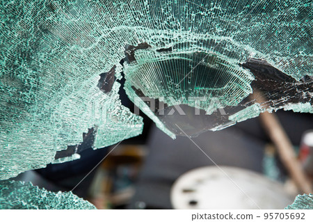 Car with broken windows. A criminal incident. Broken glass window car damaged has accident. Broken 95705692