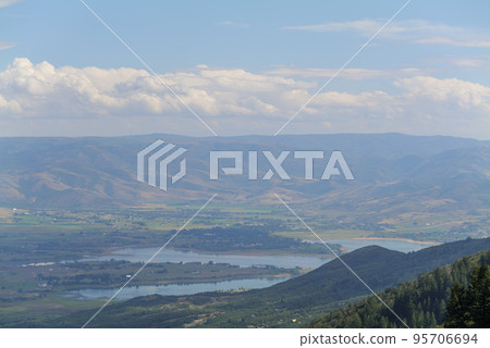 Summer mountain landscape in the USA. Sunny day and cloudy sky, hills view Summer mountain landscape in the USA. Sunny day and cloudy sky, hills view 95706694