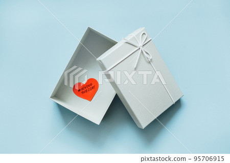 Giving Tuesday, Time to Give, Help, Donation, Support, Volunteer concept with red heart in gift box on blue background. Its time to give Giving Tuesday, Time to Give, Help, Donation, Support, Volunteer concept with red heart in gift box on blue background. Its time to give 95706915