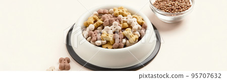 Dry dog vegan vegetarian food concept. Lentils near bowl with pet feed on beige background Dry dog vegan vegetarian food concept. Lentils near bowl with pet feed on beige background 95707632