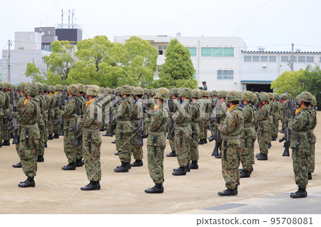 A member of the Ground Self-Defense Force who makes an offering with a Type 89 rifle A member of the Ground Self-Defense Force who makes an offering with a Type 89 rifle 95708081