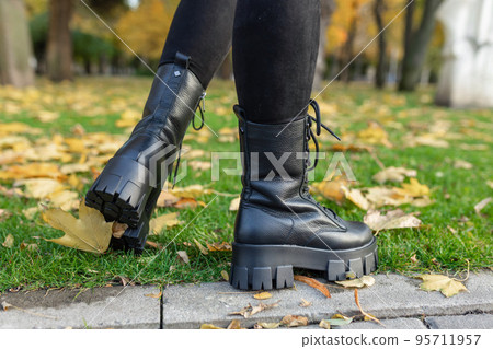 Elegant womens shoes on the foot on the street. Comfort and fashion Elegant womens shoes on the foot on the street. Comfort and fashion 95711957