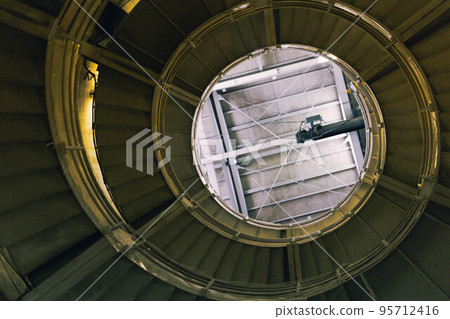 Bottom view of spiral staircase 95712416