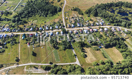 view from a height on a rural landscape with houses 95713740