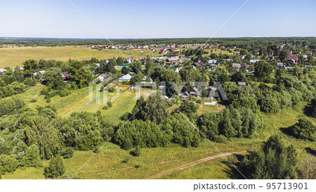 view from a height on a rural landscape with houses view from a height on a rural landscape with houses 95713901