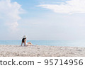 Summer vacation on the beach, Young woman relaxing on the beach with sea view 95714956