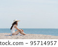 Vacation on the beach, Young woman relaxing on the beach in summer 95714957