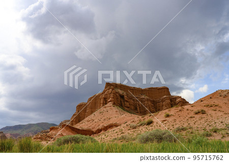 Sky over the red canyon Konorchek (Suluu-Terek) in the mountains in Kyrgyzstan 95715762