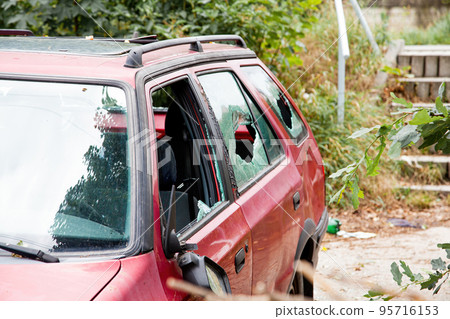 Car with broken windows. A criminal incident. Broken glass window car damaged has accident. Broken Car with broken windows. A criminal incident. Broken glass window car damaged has accident. Broken 95716153