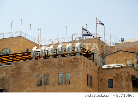 Israel national flag waving on sunny clean sky background Israel national flag waving on sunny clean sky background 95716665