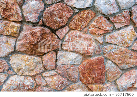 Pink marble stone wall texture background. Closeup surface grunge limestone texture, stonework rock, old pattern clean grid uneven bricks design stack. 95717600