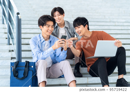 Male college student campus life student smartphone computer Male college student campus life student smartphone computer 95719422