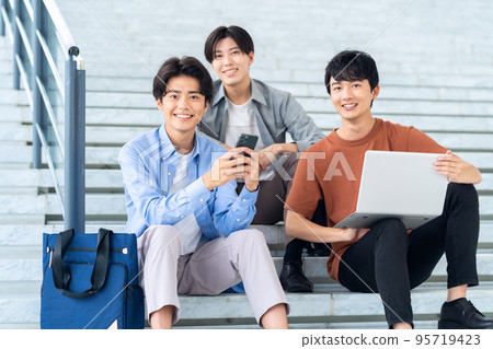 Male college student campus life student smartphone computer Male college student campus life student smartphone computer 95719423