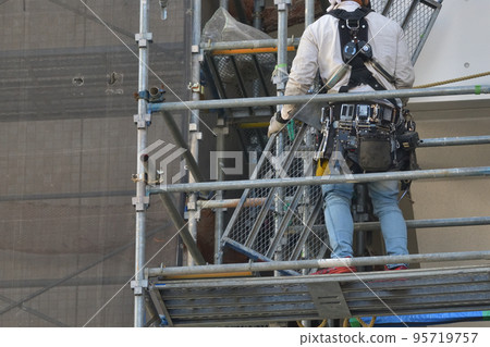Large-scale repair of an apartment building Temporary scaffolding for painting work 95719757