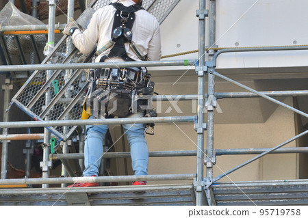 Large-scale repair of an apartment building Temporary scaffolding for painting work 95719758