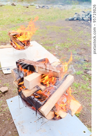 Firewood burning on the bonfire Firewood burning on the bonfire 95719826