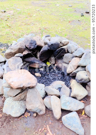 A stove made by stacking stones at a campsite A stove made by stacking stones at a campsite 95720233