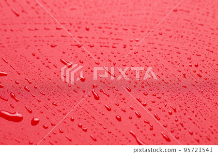 Red waterproof cloth covered with water drops Red waterproof cloth covered with water drops 95721541
