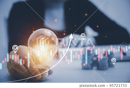 Creativity in the hands of business people idea concept, Businessman holding glowing light bulb with drawing brain ,Price of electricity is rising considerably worldwide, High energy prices in 2023. Creativity in the hands of business people idea concept, Businessman holding glowing light bulb with drawing brain ,Price of electricity is rising considerably worldwide, High energy prices in 2023. 95721733