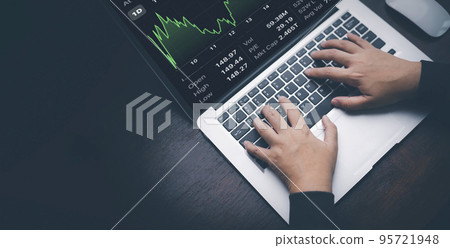 Woman using laptop with planning and strategy, Stock market, Business growth down, Concept of financial crisis, echnical price graph and indicator, red candlestick chart with analyzing forex trading. 95721948