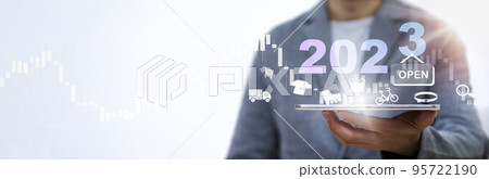 Open shopping in 2023 concept, Businessman holding tablet bar graph of analytics and financial, Changes in new planning, Business growth, ideas and perspectives, Stock investment, and dividends yield. 95722190