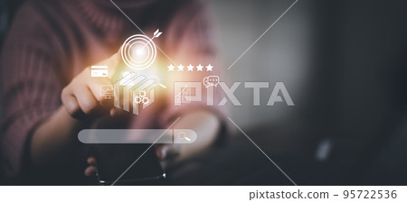 Businesswoman hand using smartphone to use search engine optimization SEO tools for finding customer or promote and advertise about content online for marketing technology and business concept. 95722536