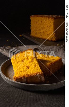 Typical spongecake of Portugal on dark background Typical spongecake of Portugal on dark background 95723380