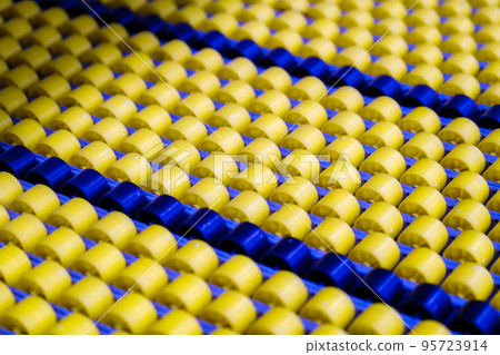 Yellow and blue conveyor rollers Yellow and blue conveyor rollers 95723914