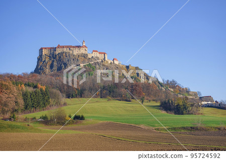 The medieval Riegersburg Castle on top of a dormant volcano, surrounded by beautiful autumn landscape, famous tourist attraction in Styria region, Austria 95724592
