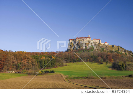 The medieval Riegersburg Castle on top of a dormant volcano, surrounded by beautiful autumn landscape, famous tourist attraction in Styria region, Austria 95724594