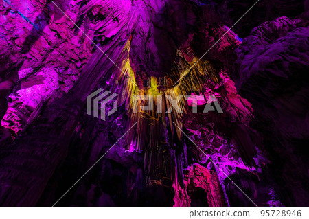 Saint Michael's Cave with colorful lights with Angel. Natural Rock Formation. Saint Michael's Cave with colorful lights with Angel. Natural Rock Formation. 95728946